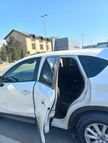 спойлер мазда демио: Mazda CX-5, ağ rəngli kompakt krossover. Əsas xüsusiyyətlər: - Geniş — 2