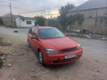 oturacaq uzlukleri: Model: Opel Astra Caravan (Universal kuzov) Rəng: qırmızı Kuzov: 5 — 2