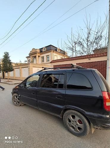 запчасти форд фокус 1: Opel Zafira A, qara rəng, 7 yerlik miniven. Xüsusiyyətlər: - Geniş — 6