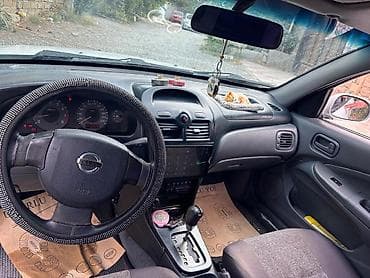 klas 6: Nissan Sunny: 1.6 l | 2007 il Sedan — 7