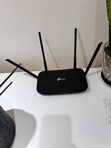 playstation 3 pro: TP-Link Wi‑Fi router - Brend/model: TP-Link (üzərində TP-Link loqosu) — 1