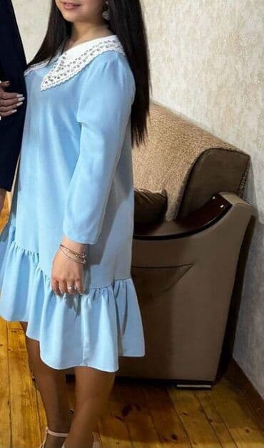 Gödək mavi rəngli qadın donu - Model: A-kəsimli, sərbəst siluet -