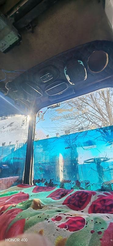 Moyka avadanlığı: Mavi rəngli kabinli təkərli kənd təsərrüfatı traktoru. Texniki — 5