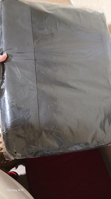 Noutbook cantasi.Məhsul: Qara rəngli qoruyucu örtük/çanta Təsvir: -