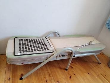 Tibb üçün masaj və digər funksiyalari olan çarpayi