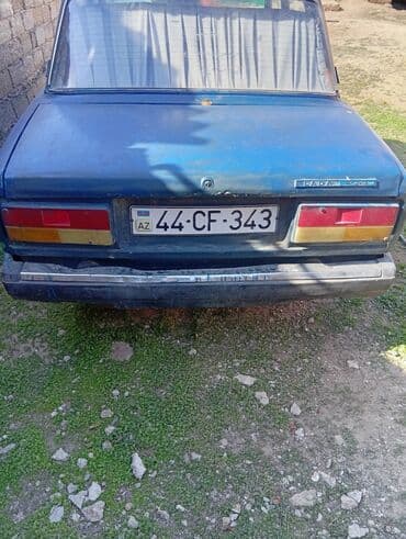 ваза стеклянная прозрачная высокая без узора: Mavi rəngli Lada 2107 modeli, klassik sedan tipli avtomobil — 2