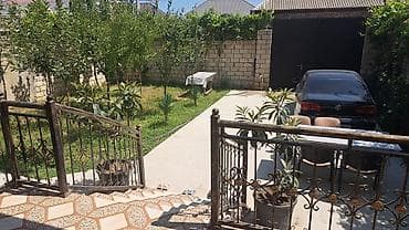 nizami ev: 2 mərtəbəli fərdi yaşayış evi. Evin fasadı müasir üslubda işlənib — 3