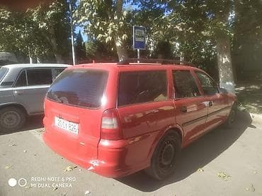 ford transit 2009: Opel Astra Vectra (ünvan nömrəsi görünür), qırmızı rəngli universal — 2