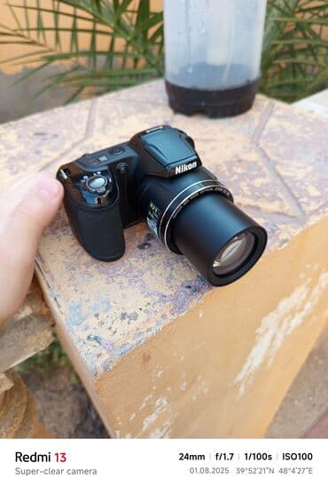 yemek bisiren aparat: Nikon brendinə məxsus qara rəngli fotoaparat, istifadəçilər üçün rahat — 4