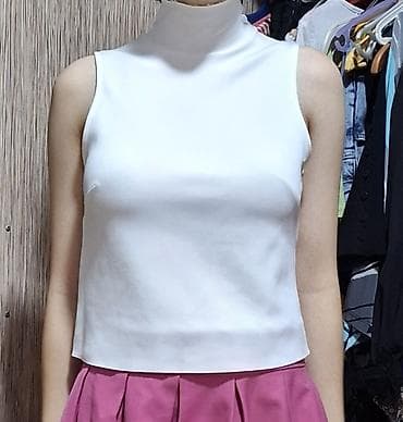 Ağ rəngli qolsuz top – hündür boğazlı.
Çatdırılma var