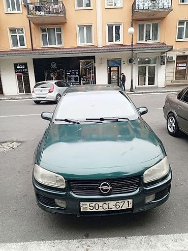 ford fusion ehtiyat hisseleri: Opel Omega sedan - Kuzov: 4 qapılı sedan, tünd-yaşıl rəng - Mühərrik — 2