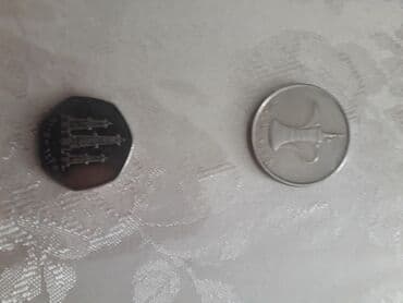 50 rubl nece manatdir: Gumus qepik 2 eded - 1 dirhəm: dairəvi nikel‑rəngli sikkə. Ön üzündə — 1