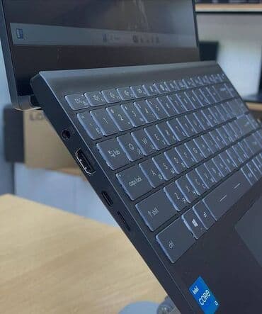 a 11: MSI ultrabook – zərif və yüngül metal gövdə, tünd boz rəng. 14″ nazik — 2