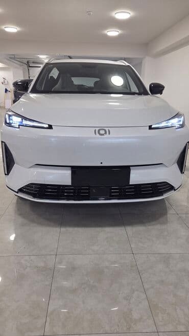 yağış sensoru: Model: Qiyuan Q05 125 km AIR (ağ rəngli, SUV) Xüsusiyyətlər və dizayn — 1