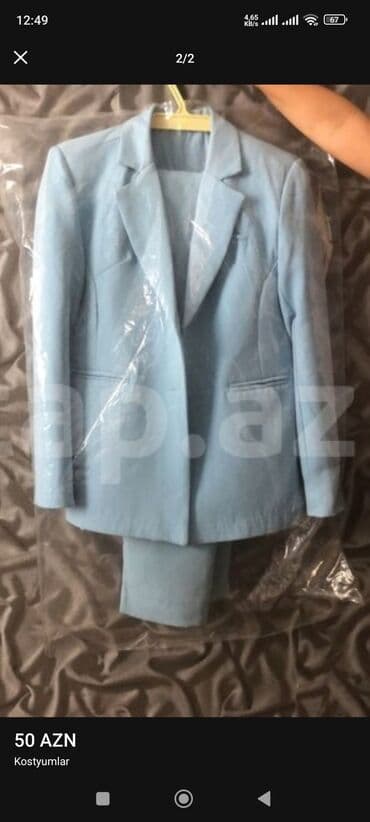 голубые женские костюмы: Açiq mavi rəngdə qadın kostyumu. Kostyum uzunqol pencək və şalvardan — 1