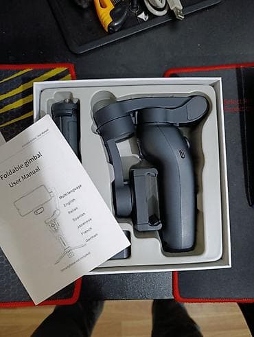 gimbal: F12 3-oxlu qatlanan smartfon stabilizatorunu (gimbal) göstərir.Cihazın — 2