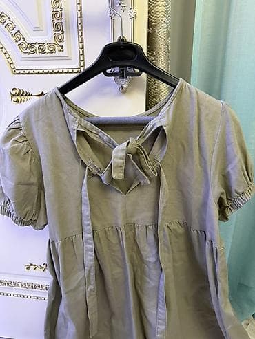 donları: Uzunluğu dizdəndir, sadəcə 2 dəfə geyinilib. Zeytun-yaşıl rəngdə — 2