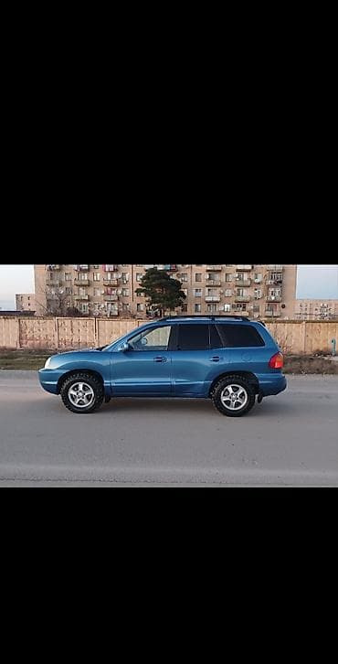 ij disklər: Hyundai Santa Fe – mavi rəngli, 5 qapılı SUV. Texniki və dizayn — 4
