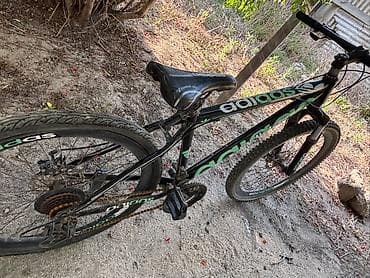 velosiped kameri: Velosiped – dağ/şose hibrid tipli, qara-yaşıl dizayn. Xüsusiyyətlər — 1