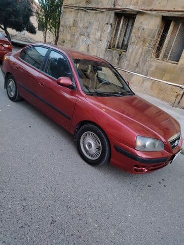 bmw f30 qiyməti: Hyundai Elantra sedan, qırmızı rəng. Arxa hissədə “Elantra” və “GLS” — 6