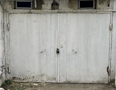 Mağaza/qaraj tipli metal qapı - İkiyarpaq, tammetaldan hazırlanmış