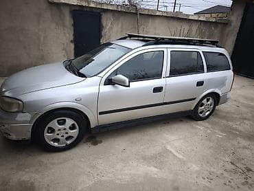 kia optima 2013: Opel Astra Caravan (universal) – gümüş rəngli kuzov, 5 qapı, dam — 5