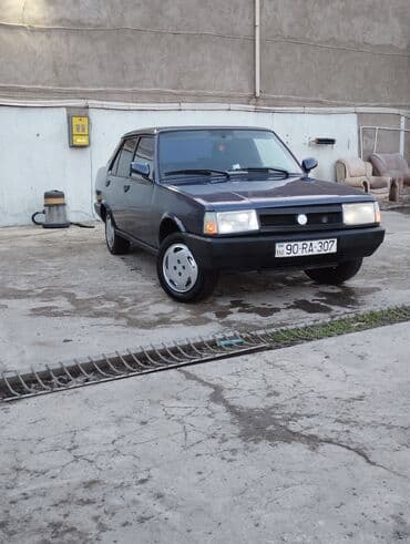 tofas mostu satilir: Model: Tofas Şahin/Doğan seriyası (sedan) Kuzov: 4 qapılı, tünd göy — 2