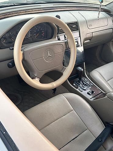 priora diskleri: Mercedes-Benz C-Sinfi sedan (W202) – tünd yaşıl rəng, bej dəri salon — 7