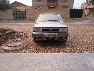 işlənmiş radiatorlar: Model: Tofaş Şahin/Doğan (sedan) Kuzov: 4 qapılı, boz rəng Nömrə: AZ — 2