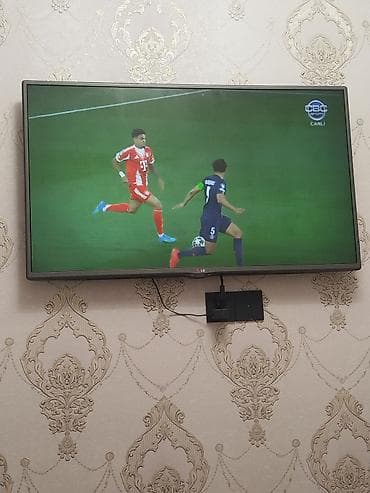 LG LED televizor – divara quraşdırılmış, nazik çərçivəli model. Ekran