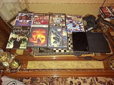 irşad electronics ps4: PlayStation 2 Slim (Sony) oyun konsolu seti.Cox az işlənib. Komplekt — 3