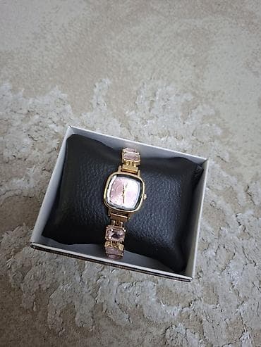 Qızılı tonlarda zərif qadın qol saatı - Korpus: kvadratvari yumru lalafo.az -da Qızılı tonlarda zərif qadın qol saatı - Korpus: kvadratvari yumru