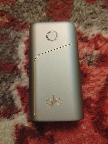 Glo tütün qızdırma cihazı Yaxşı vəziyyətdədi adaptırıda var. Real