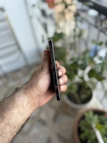 nintendo switch oled qiymeti: IPhone 14 Pro, Deep Purple, Face ID — 2