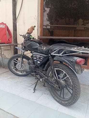 Moto velosiped – şəhər və kənd yolları üçün praktik nəqliyyat