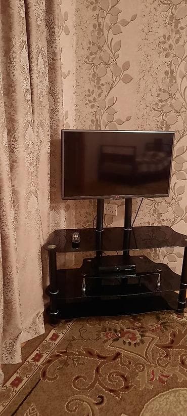 divar kitab refleri: LG televizor + şüşə TV stendi (dəst) Məhsulun tərkibi: - LG LED — 4