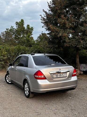 mersedes disk r15: Nissan Tiida: 1.6 l | 2006 il Sedan — 9