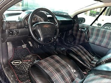 islenmis teker satisi: Opel Tigra: 1.6 l | 1997 il 30000 km Sedan — 7