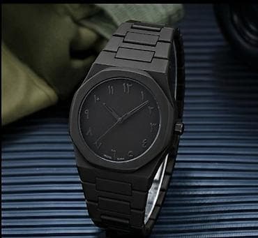 Qara metal korpuslu, minimalist üslubda kişilər üçün qol saatı. Tam — 1