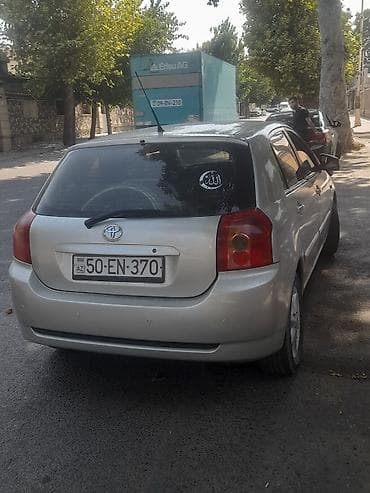 2005 kia sephia: Toyota Corolla: 1.4 l | 2005 il Hetçbek — 2