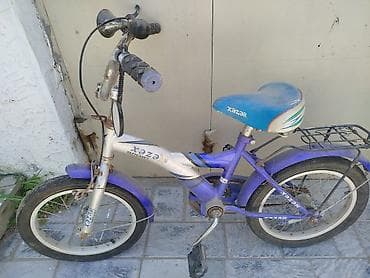velosiped baqaji: Yaşıl rəngdə STELS Navigator velosipedi. Bu model alçaq çərçivəyə — 2