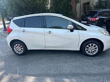 nisan note: Nissan Note – ağ rəngli, 5 qapılı kompakt hetçbek. Nissan Note 2015 — 6