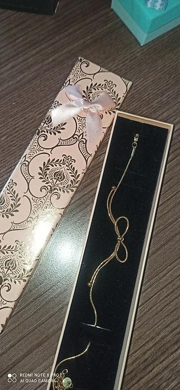 Muncuqlar: Qızılı rəngdə zərif qolbaq.Qaralmiyan qutusuyla stal hem ayaq hem qola — 1