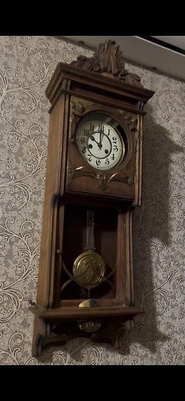 canavar sekileri: Divar saatları, Mexaniki, Mayatnik — 1