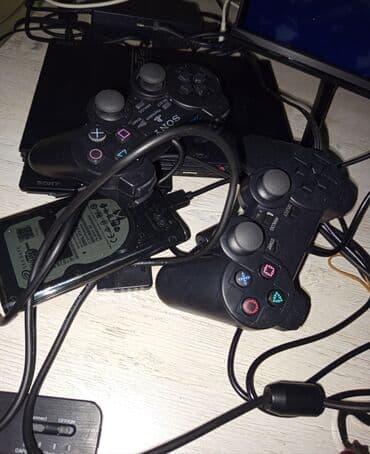 как купить игру в playstation store азербайджан: Sony PlayStation 2 oyun konsolu, iki ədəd qara rəngli idarəetmə pultu — 1