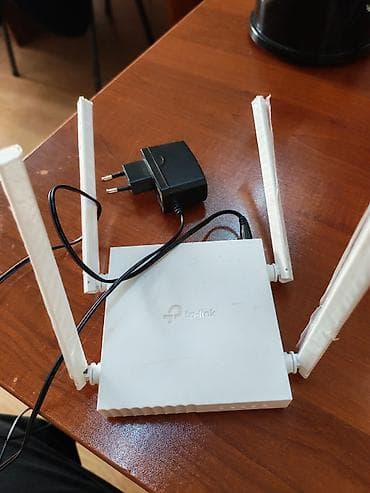TP-Link Wi‑Fi router - Brend/model: TP-Link (üzərində TP-Link loqosu)