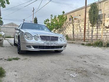 şuşe qaldıran: Mercedes-Benz E-Class sedan (W211), gümüşü rəng. Xüsusiyyətlər: - — 3