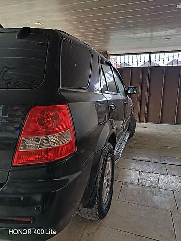 vito oturacaq: Kia Sorento, qara rəng, SUV kuzov. Güclü və rahat ailə maşını — 5
