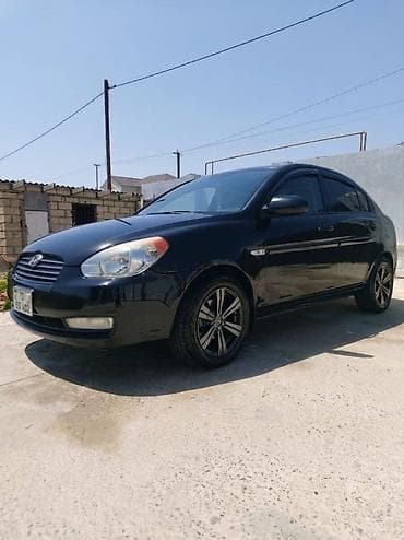 multi sukan: Hyundai Accent: 1.4 l | 2008 il Sedan — 7