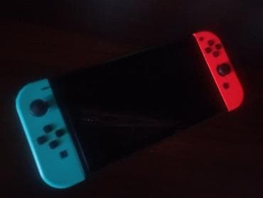 Nintendo Switch (Neon Blue/Neon Red Joy‑Con) - Portativ və stasionar